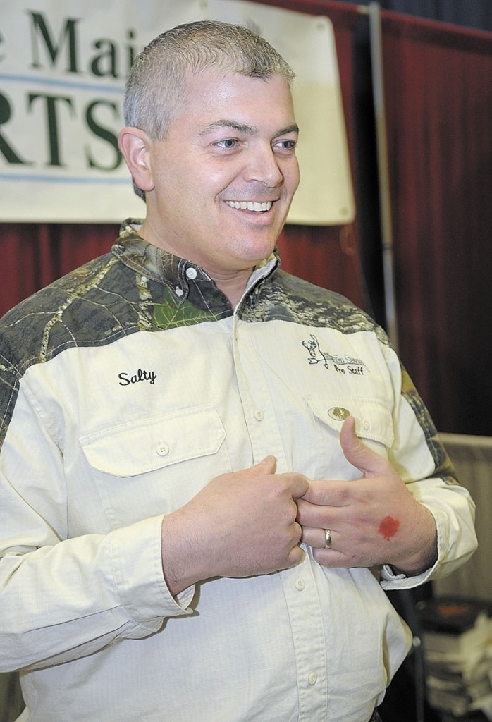 TALKING BUCKS: Joe Saltalamachia talks about hunting big bucks during an interview Friday at the Maine Sportman's Show at the Augusta Civic Center. His advice to hunters who think they've got a buck that might dress out over 200 pounds is to not cut out too much hide and interior fat when field dress their deer.