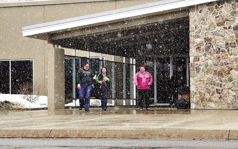 LOCAL JOBS: T-Mobile call center employees in Oakland are shown leaving work in March. An AT&T official said Monday the company has no plans to close the call center if AT&T merges with T-Mobile USA.