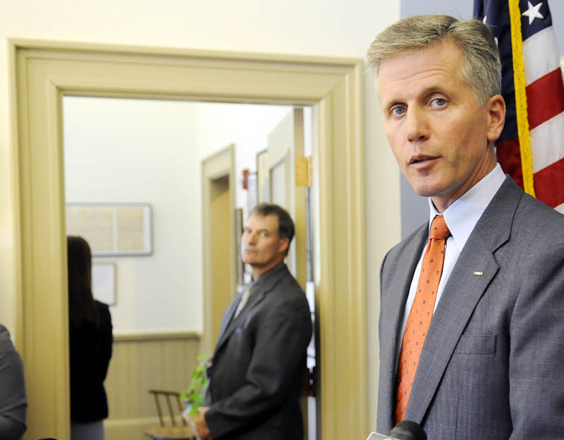 Secretary of State Charlie Summers announced he is pursuing a two-pronged investigation into potential voter fraud, stemming from allegations made by an employee within his department and leaders of the Maine Republican Party, at a press conference Thursday at his Augusta office. At left is Detective Bruce Hurley with the Secretary of State's Office.