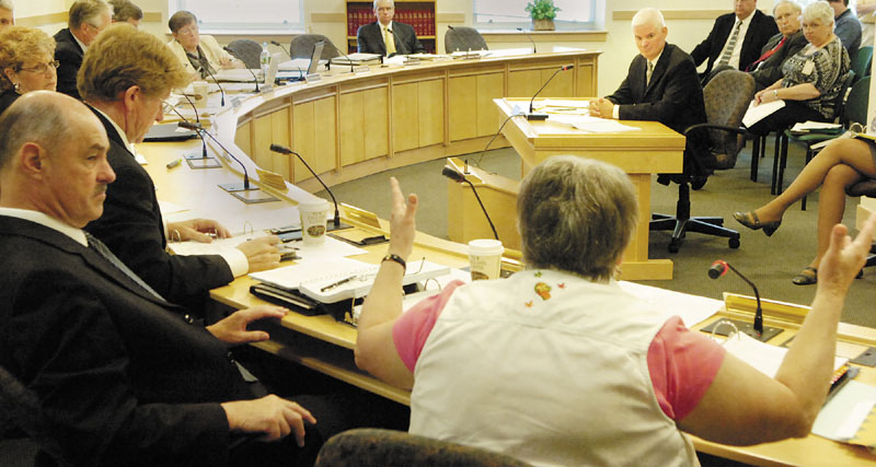 QUESTION: State Sen. Nancy Sullivan, D-Biddeford, bottom right, asks Chip Gavin, former Bureau of General Services Director, a question during a Government Oversight Committee hearing about the Thomaston land sale on Tuesday morning in Augusta.