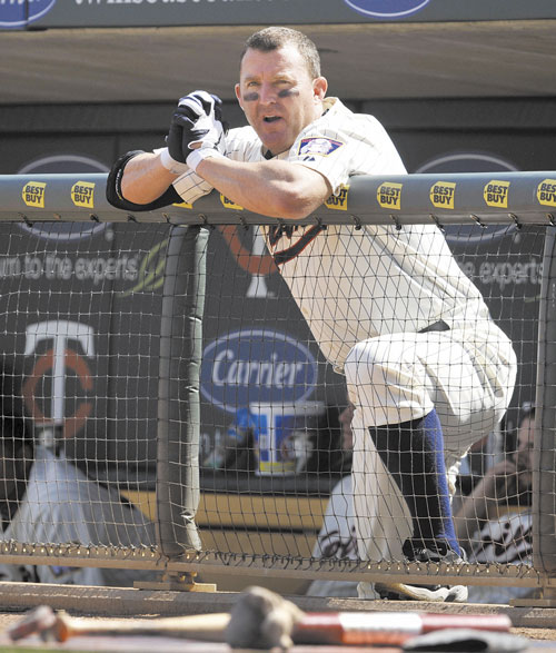 WAITING IT OUT: Minnesota’s Jim Thome watches from the dugout as the Chicago White Sox bat during the eighth inning in Minneapolis. Thome is two home runs shy of 600 for his career.