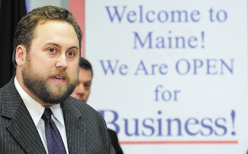 BUSINESS BOOST: Christopher Farmer, USA Lifestyles president and Saddleback general manager, speaks at a news conference in the State House's Cabinet Room on Tuesday in Augusta.