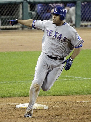 Texas Rangers' Nelson Cruz rounds first base after hitting a three-run home run in the 11th inning in Game 4 the ALCS on Wednesday in Detroit.