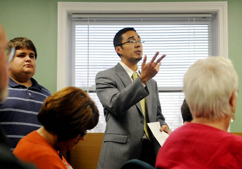 TRYING TO RESOLVE PROBLEMS: New Regional School Unit 2 superintendent Virgel Hammonds addresses the Richmond selectmen meeting Wednesday. Hammonds — who started the job in July after moving to central Maine from California — is traveling to town halls and private homes to meet as many people as he can to try to improve communication in a splintered district where two towns are considering withdrawal.