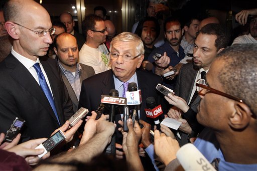 NBA Commissioner David Stern talks to reporters as he leaves the NBA labor talks Monday in New York. Stern canceled the first two weeks of the season Monday after players and owners were unable to reach a new labor deal to end the lockout. "The gap is so significant that we just can't bridge it at this time," said Stern, who added it's doubtful a full 82-game season can be played. At left is Deputy Commissioner Adam Silver.