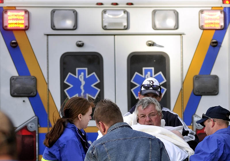 Staff photo by Michael G. Seamans Rescue personel from Oakland, Smithfield and Belgrade responded to a boat accident on North Pond just after 4pm Wednesday. The victim was transported to Inland Hospital in Waterville.