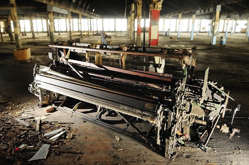 A derelict loom sits on the second floor of the Bates Mill No. 5 in Lewiston. It is the proposed site of a casino.