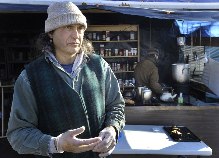 Randy Santa Cruz, a participant in the Occupy Maine movement, speaks about an incident the night before that resulted in five arrests at the Lincoln Park campsite.