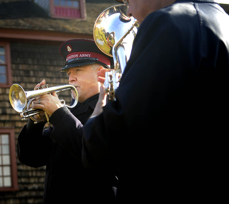 KETTLE KICKS OFF: Salvation Army Major Norman Garcia plays the coronet during the kickoff to the Salvation Army’s annual kettle campaign Wednesday at Old Fort Western in Augusta. Garcia and his brass ensemble serenaded guests that raised awareness about the red kettles and bell ringers from the Salvation Army. Augusta Mayor Bill Stokes and Police Chief Robert Gregoire hosted the Salvation Army, which assisted 389 people during the holiday season and 808 people from Augusta during the course of the year.