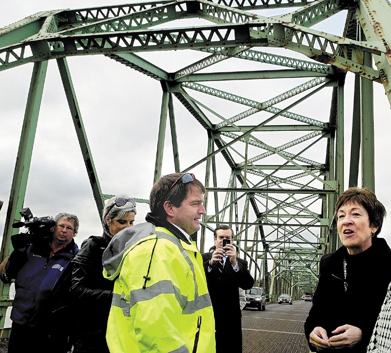 SEEKING FEDERAL FUNDING: Maine Dept. of Transportation Commissioner Dave Bernhardt, left, chats with Sen. Susan Collins on the Maine Kennebec Bridge, known to locals as the Richmond-Dresden Bridge, during a news conference there on Friday in Dresden.