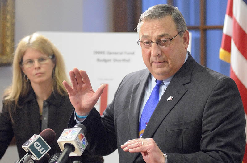 Mary Mayhew, Commissioner: Department of Health & Human Services, left, and Gov. Paul LePage answer questions during a news conference to announce changes to the MaineCare system on Tuesday in the State House's Cabinet Room in Augusta.