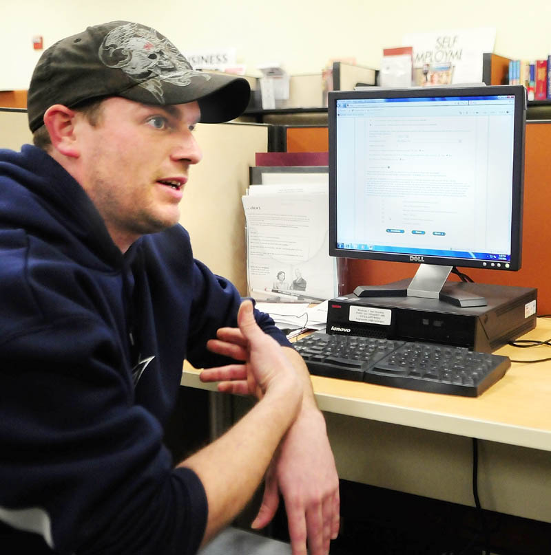 LOOKING FOR WORK: Jason Kurtz, of Sidney, answers questions during an interview on Thursday afternoon at the Augusta Career Center. Kurtz said that he is often at the center using the computers to look for a job.