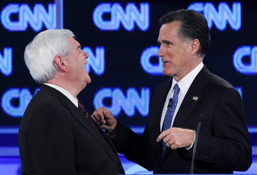 Republican presidential candidates, former House Speaker Newt Gingrich and former Massachusetts Gov. Mitt Romney talk during a commercial break at the Republican presidential candidates debate in Jacksonville, Fla. (AP Photo/Matt Rourke, File)