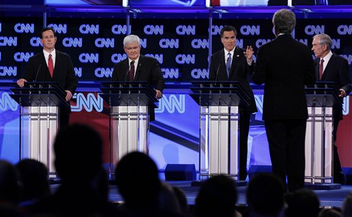 Republican presidential candidates, from left, former Pennsylvania Sen. Rick Santorum, former House Speaker Newt Gingrich, former Massachusetts Gov. Mitt Romney and Rep. Ron Paul, R-Texas, look toward moderator Wolf Blitzer of CNN as they participate in the Republican presidential candidates debate in Jacksonville, Fla., Thursday, Jan. 26, 2012. (AP Photo/Matt Rourke)