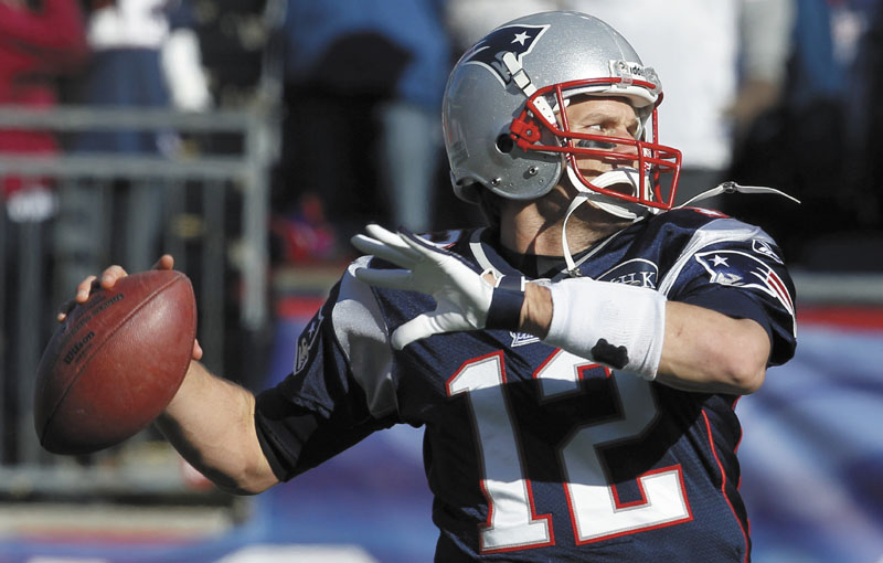 AP photo ON THE VERGE OF HISTORY: New England quarterback Tom Brady needs 103 yards to become the third quarterback to surpass 5,000 passing yards in a season when the Patriots host the Bills in their regular-season finale today.