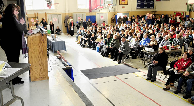 Teresa McCann-Tumidajski, Executive Director of Maine Right to Life, speaks on Saturday in the St. Michael School gym during the "Hands Around the Capitol Rally and March" The rally and march to the state house is held each year to recognize the anniversary of the Supreme Court's Roe vs. Wade decision.