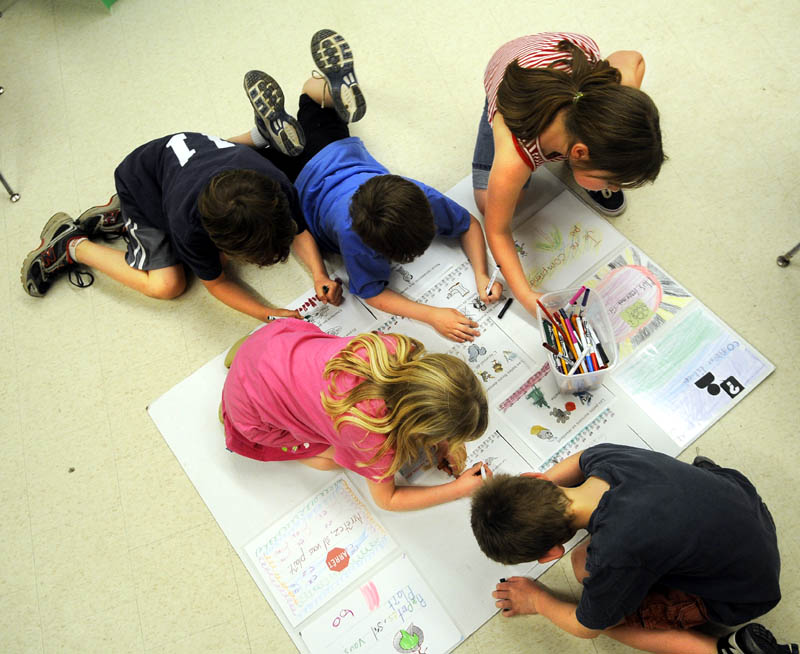 CREATIVE LEARNING: Hussey Elementary students color together Thursday during an afterschool Franco-American culture program that’s funded through a grant. Franco-Americans’ culture and their regional variant of the French language wasn’t always appreciated, either in the streets of Augusta or the classroom.