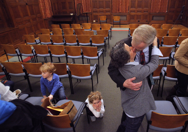 Angus King kisses his wife, Mary, at Bowdoin College on Monday night. He said that he is running for the Senate seat being vacated by Olympia Snowe.