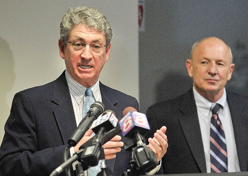 Augusta Mayor William Stokes, left, answers questions as Portland Mayor Michael Brennan, right, listens during a news conference at the State House on Thursday in Augusta.