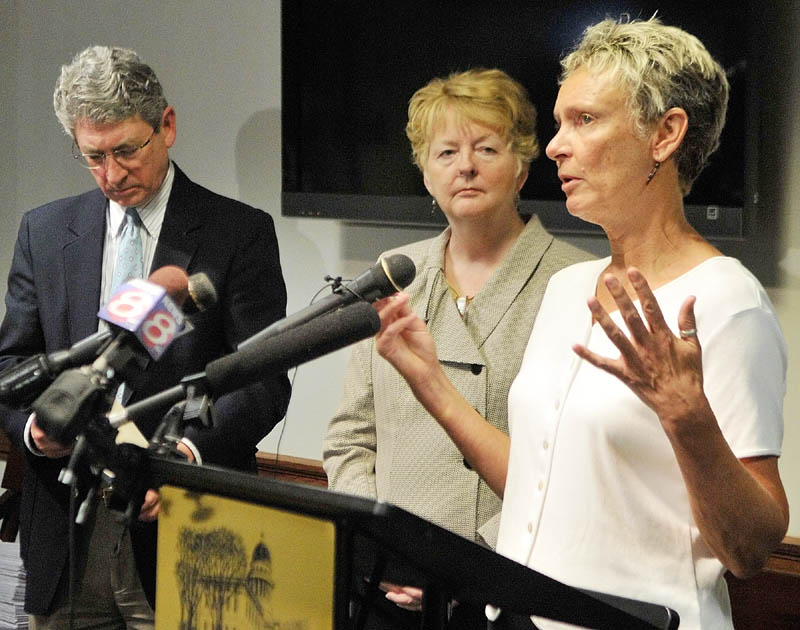 Augusta Mayor William Stokes, left, and Westbrook Mayor Colleen Hilton listen as Waterville Mayor Karen Heck, right, answers a question during a news conference at the State House on Thursday in Augusta. A group of mayors from the state's largest cities announced the formation of a Mayors Coalition on Jobs and Economic Development, they said their top priority is fighting the general assistance cuts, which could save the state nearly $6 million.