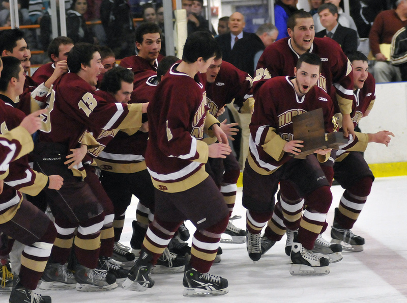 Thornton Academy's C.J. Maksut, above with trophy, led Class A with 32 goals, including three in the state final against St. Dominic. He was named Class A's best player Sunday, March 18, 2012, receiving the Travis Roy Award.