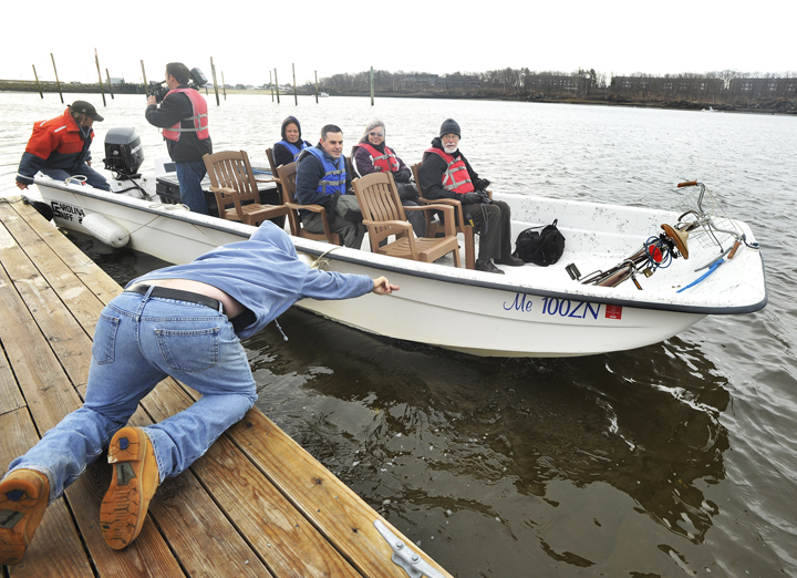 The University of New England's ferry service between Camp Ellis in Saco and the UNE pier in Biddeford carries UNE faculty and media members on the inaugural Saco River crossing today.