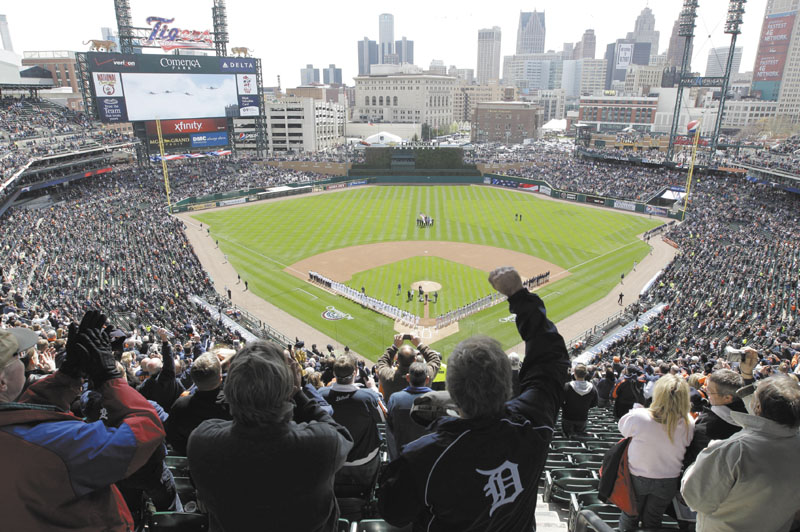 READY TO GO: Fans cheer after the national anthem before the season opener between the Boston Red Sox and Detroit Tigers on Thursday in Detroit.