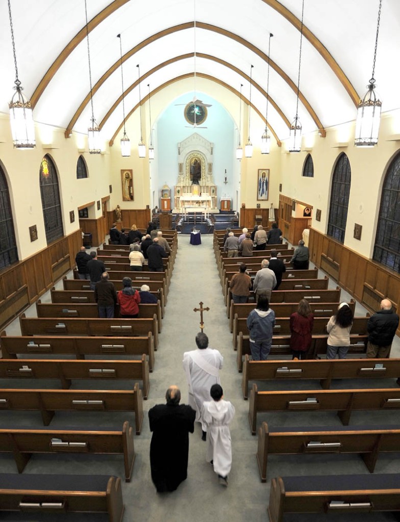 Staff Photo by Michael G. Seamans The Holy Thursday service at St. Joseph's Maronite Church in Waterville Thursday evening. In the Holy Thursday service, Father Larry Jensen washed the feet of some parishiners as did Jesus and his disciples before the Last Supper.