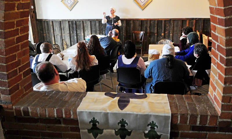 Mistress Suzanne Neuber de Londres teaches a class during The East Kingdom Brewers' Collegium event sponsored by the Society for Creative Anachronism on Saturday at the River Back Dance Club in Augusta.