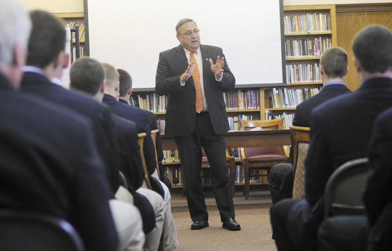 IMPORTANT MESSAGE: Gov. Paul LePage speaks with Cheverus High School’s football team Wednesday about domestic violence. The team, which visited LePage at the Blaine House after winning the state championship last fall, signed a petition Wednesday to stand behind the governor in his efforts to end domestic violence.