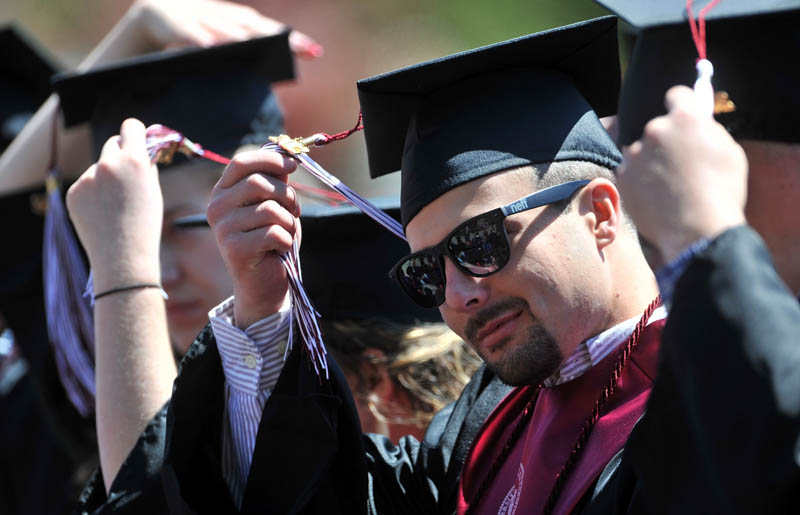 Staff Photo by Michael G. Seamans University of Maine at Farmington graduates move their tassles during commencement ceremonies at University of Maine at Farmington Saturday.