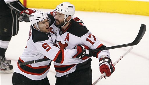 New Jersey Devils' Ilya Kovalchuk, of Russia, (17) celebrates with Zach Parise after scoring an open net goal in the third period during Game 4 of the NHL hockey Stanley Cup finals, Wednesday, June 6, 2012, in Los Angeles. The Devils won the game 3-1. (AP Photo/Jae C. Hong)