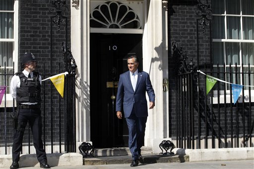 Republican presidential candidate, former Massachusetts Gov. Mitt Romney walks out of 10 Downing Street after meeting with British Prime Minister David Cameron in London, Thursday, July 26, 2012. (AP Photo/Charles Dharapak)