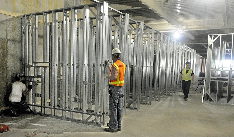 Workers frame walls at MaineGeneral's new regional hospital under construction in North Augusta in this May 27, 2012, photo. The $312 million project was expected to generate 400 to 500 construction jobs over the summer.