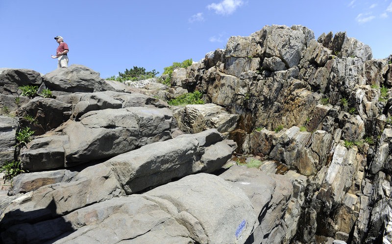 Don Miskill pauses at the top of the Giant’s Stairs on Bailey Island, part of the Harpswell experience that townspeople hope draws visitors from near and far.