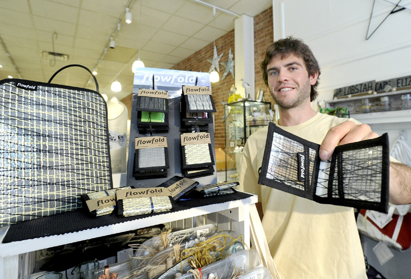 WARES: Charles Friedman is founder of FlowFold wallets and tablet cases seen here last week at Lisa-Marie's Made in Maine store in Portland.