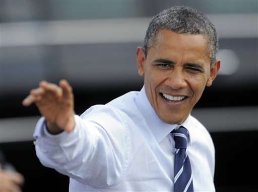 President Barack Obama waves to supporters as he arrives at Fort Collins-Loveland Municipal Airport, Tuesday, Aug. 28, 2012, in Loveland, Colo. (AP Photo/Jack Dempsey)