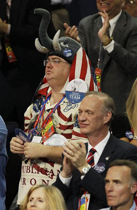 A delegate listens to New Jersey Governor Chris Christie during the Republican National Convention in Tampa, Fla., on Tuesday, Aug. 28, 2012. (AP Photo/Charlie Neibergall)