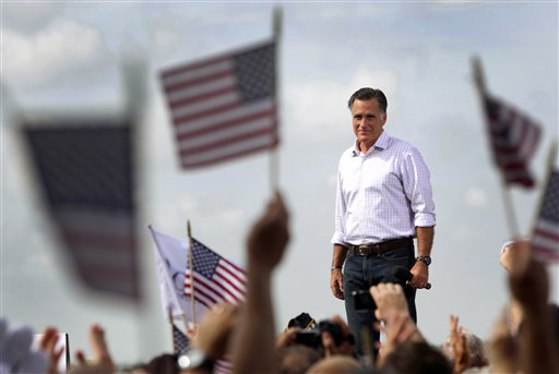 FILE - In this Aug. 31, 2012, file photo Republican presidential candidate, former Massachusetts Gov. Mitt Romney appears on stage during a campaign event at Lakeland Linder Regional Airport in Lakeland, Fla. Romney and President Barack Obama have made the election not just about the economy, or even the American Dream, but America itself. They see a nation pessimistic about itself and nervous about its future, and a political opportunity in the anxiety to come through as the one who gets what it means be American, and restore the glory. (AP Photo/Mary Altaffer, File)