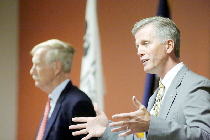 Republican candidate for U.S. Senate Charlie Summers answers a question during a debate at Texas Instruments in South Portland on Wednesday. At left is Independent candidate Angus King. Democratic candidate Cynthia Dill could not attend the debate because of a scheduling conflict.