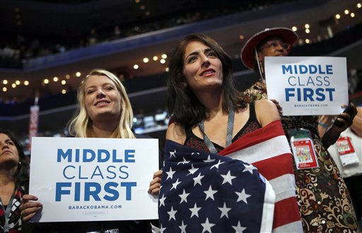 In this Spet. 5, 2012, photo, delegates watch as former President Bill Clinton addresses the Democratic National Convention in Charlotte, N.C. The placards on display as Clinton addressed the DNC said, "Middle Class First." And indeed, speaker after speaker has evoked the party's devotion to the lot of middle-class Americans in 2012. The rich also have featured in the rhetoric, albeit as a punching bag. But the poor? Not so much. They've been mentioned only fleetingly. The discrepancy makes sense, from the standpoint of campaign strategy for President Barack Obama. A large majority of Americas identify themselves as middle class, while the poor lack political clout for a host of reasons. Yet for a party that has long embraced a role as defender of the downtrodden, the rhetorical patterns are striking. (AP Photo/Jae C. Hong)