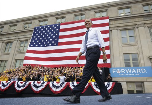 FILE _ In this Sept. 7, 2012, file photo President Barack Obama smiles as he takes the stage during a campaign event at the University of Iowa in Iowa City, Iowa. Obama and Republican presidential candidate Mitt Romney have made the election not just about the economy, or even the American Dream, but America itself. They see a nation pessimistic about itself and nervous about its future, and a political opportunity in the anxiety to come through as the one who gets what it means be American, and restore the glory. (AP Photo/Pablo Martinez Monsivais)