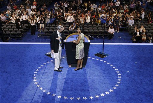 First Lady Michelle Obama listens to a production manager during a sound check for the Democratic National Convention in Charlotte, N.C., on Monday.