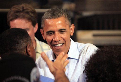 President Barack Obama greets people during a campaign stop at Florida Institute of Technology's Charles and Ruth Clemente Center in Melbourne, Fla. on Sunday.