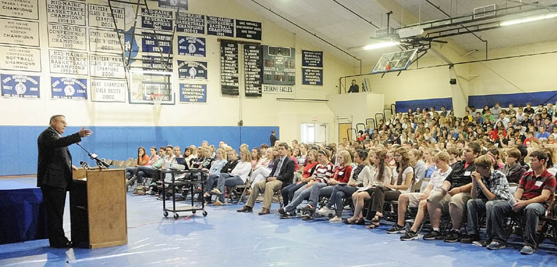 Staff photo by Joe Phelan Gov. Paul LePage speaks to students assembled in the gym on Wednesday afternoon at Erskine Academy in China. LePage spoke about stopping domestic abuse and violence. After speaking the governor took questions from the audience.