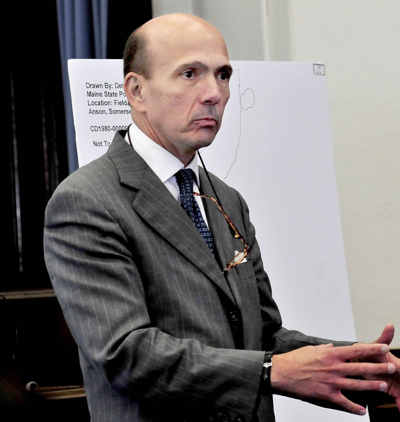 Staff photo by David Leaming EVIDENCE: Assistant Attorney General Andrew Benson presents evidence to the jury during opening statements in the trial of jay Mercier in Somerset County Superior Court in Skowhegan on Thursday.