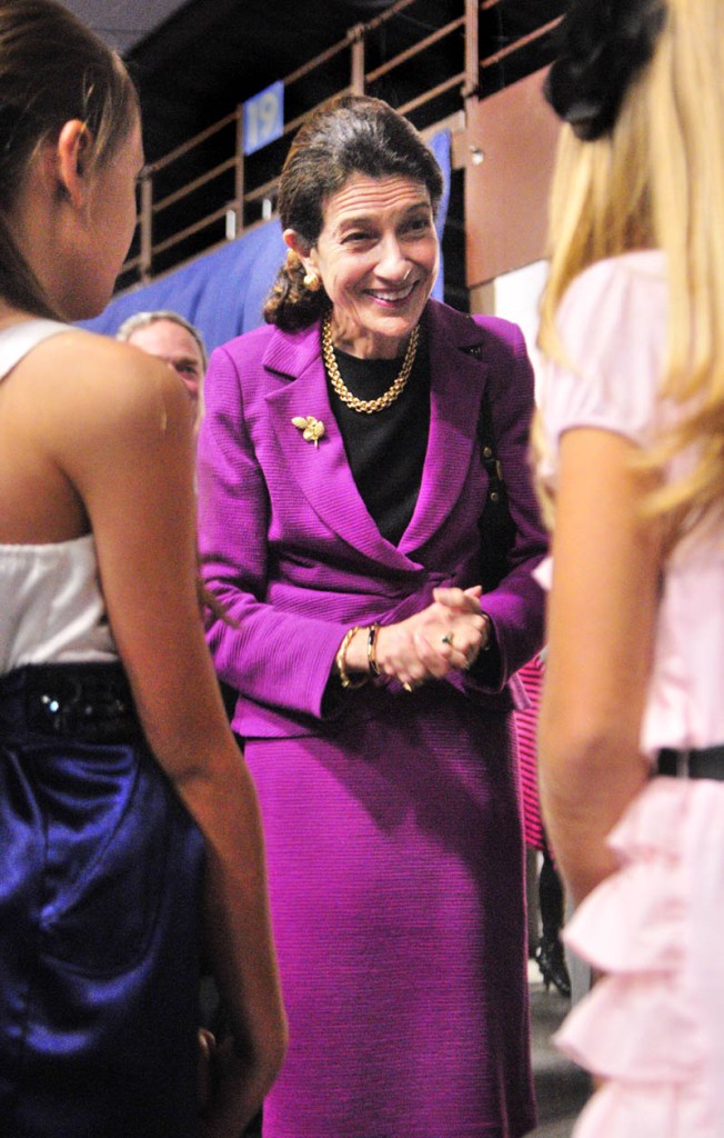 U.S. Sen. Olympia Snowe, center, greets Mia-Angelina Leslie, left, 10, and her sister Maddy Leslie, 12, both of Lewiston, on Friday evening at the start of the Maine State Chamber of Commerce Awards at the Augusta Civic Center.