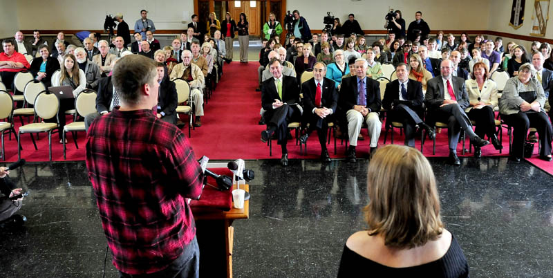 NEW BEGINNING: Maine Academy of Natural Sciences school students Nicholas Fothergill and Olivia Broadrick address staff, students, legislators, state officials and donors on the first day of the new charter school on the Good Will- Hinckley campus on Monday.