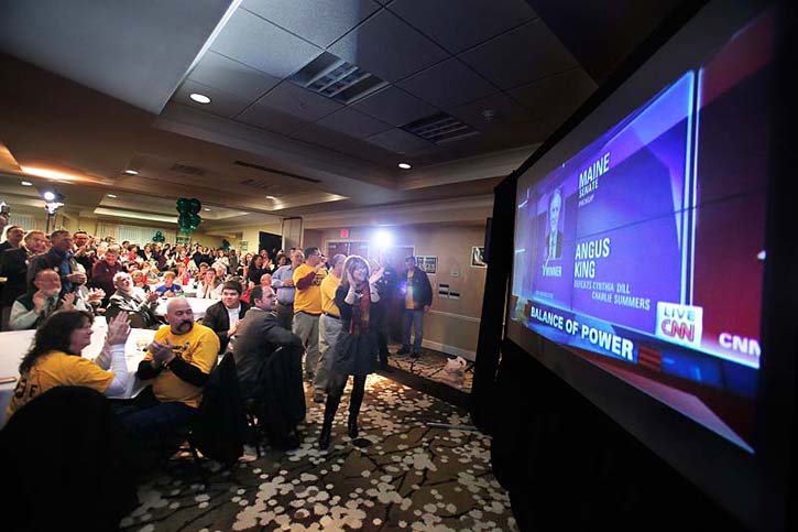 Angus King supporters cheer in Freeport on Tuesday night upon seeing CNN call Angus King the winner of the U.S. Senate race in Maine.