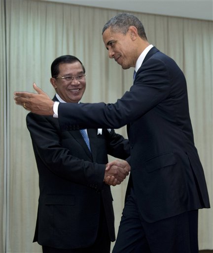 U.S. President Barack Obama is welcomed by Cambodia's Prime Minister Hun Sen as he arrives at the Peace Palace in Phnom Penh, Cambodia, Monday, Nov. 19, 2012. Obama will attend the East Asia Summit. (AP Photo/Carolyn Kaster)